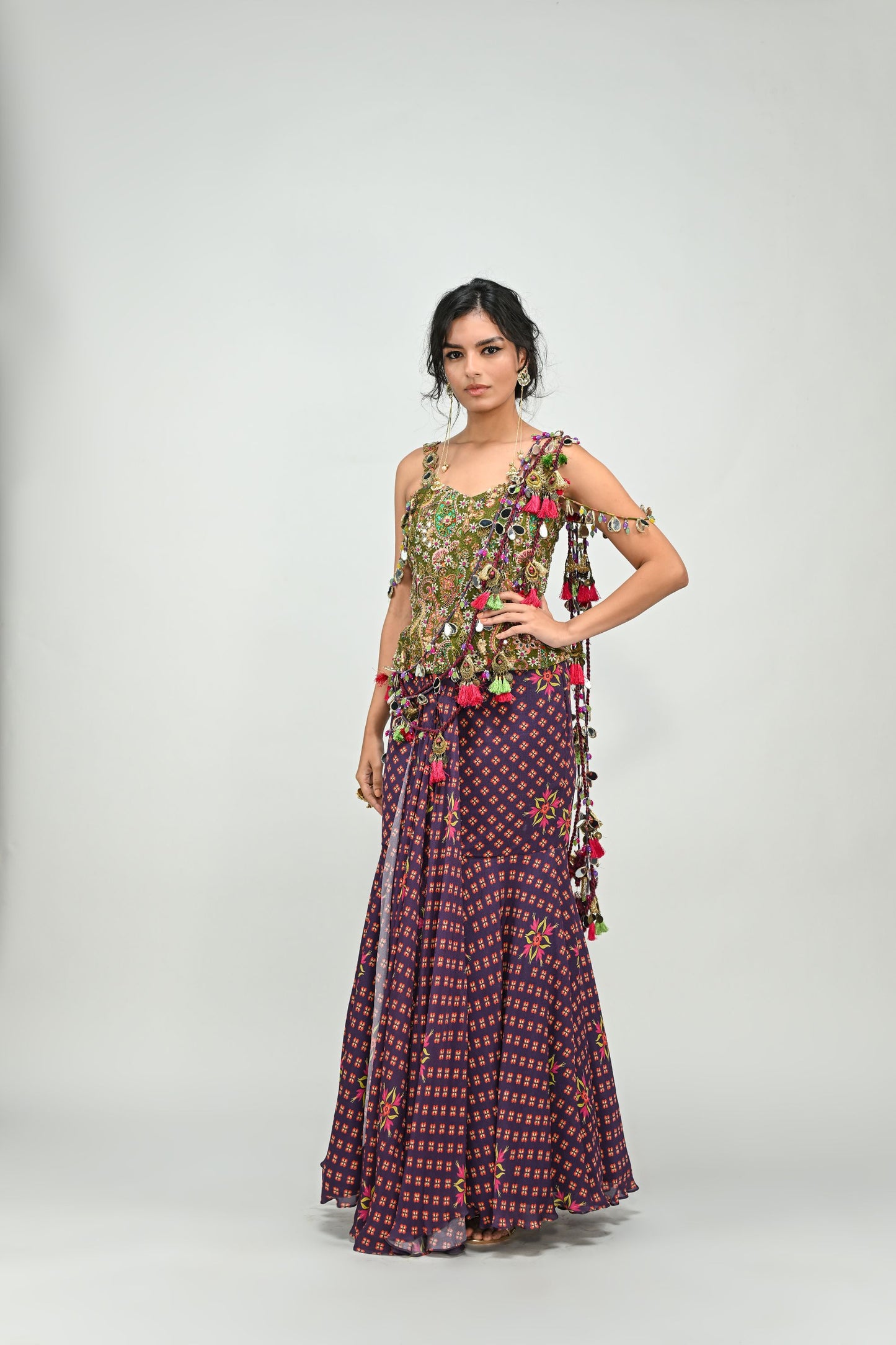 PLUM PRESTITCHED TASSEL SAREE PAIRED WITH BADLA EMBROIDERED GREEN CORSET