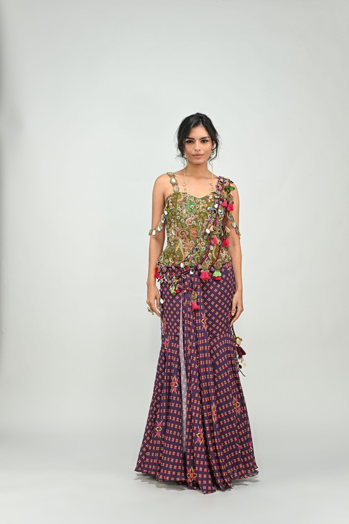 PLUM PRESTITCHED TASSEL SAREE PAIRED WITH BADLA EMBROIDERED GREEN CORSET
