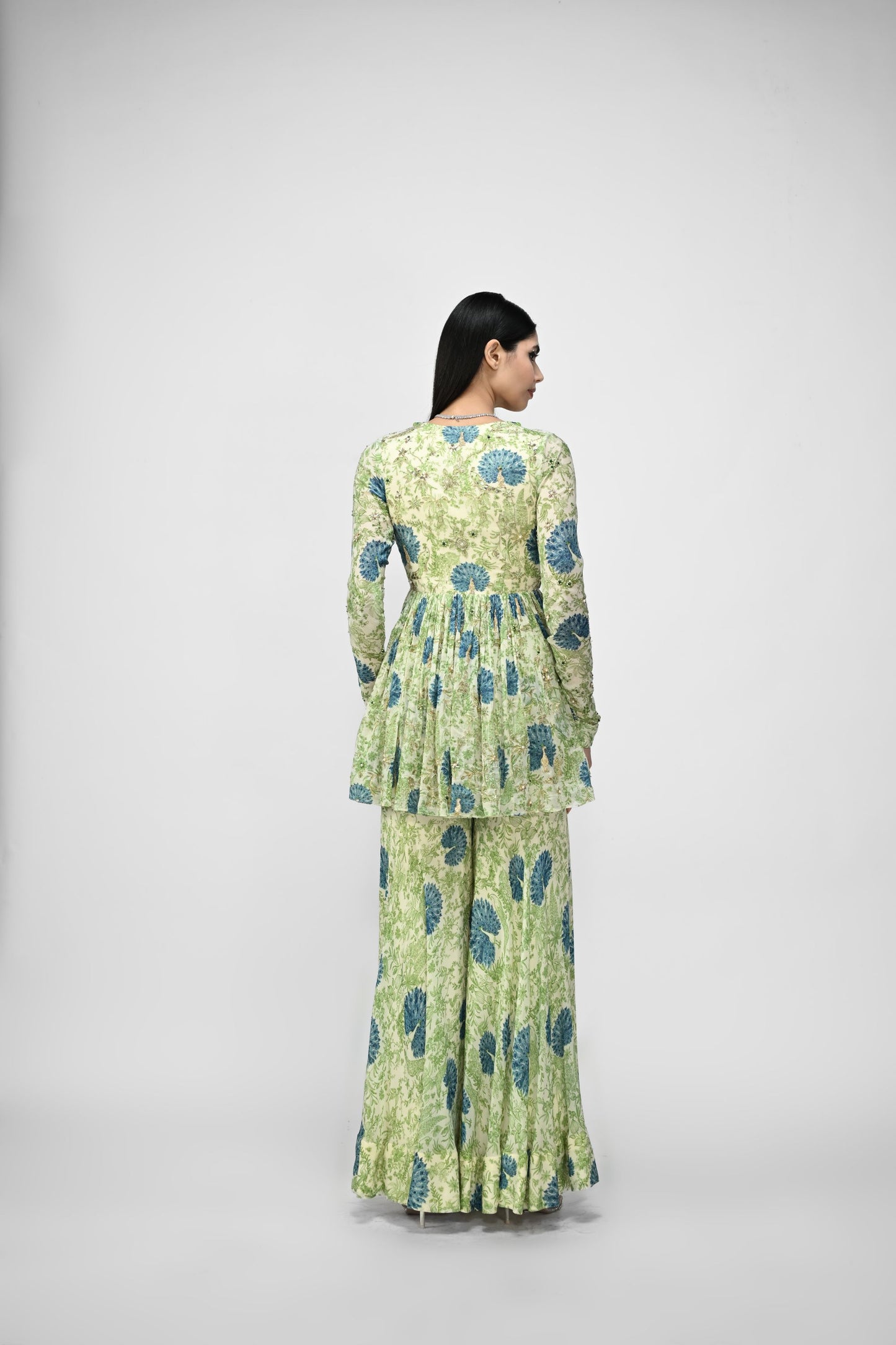 Peacock Highlited Peplum Kurta Paired With Peacock Sharara Pants