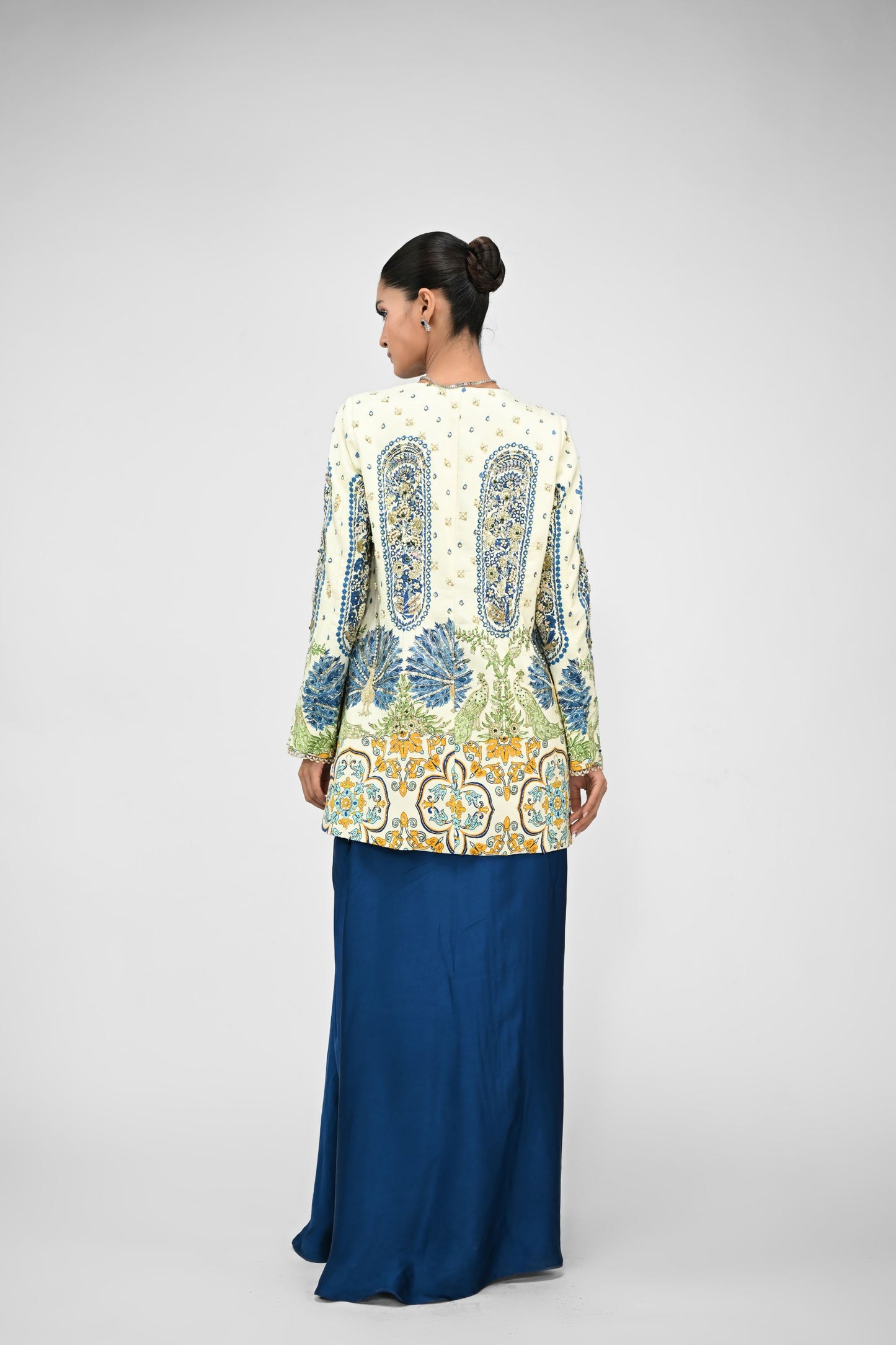 Royal Highlighted Blazer Paired With Peacock Bralette And Blue Cowl Skirt