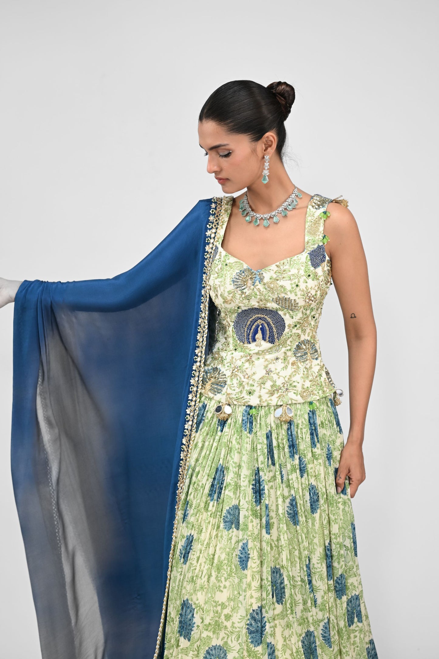 Peacock Highlighted Lehenga Paired With Highlighted Peacock Corset And Embroidered Dupa