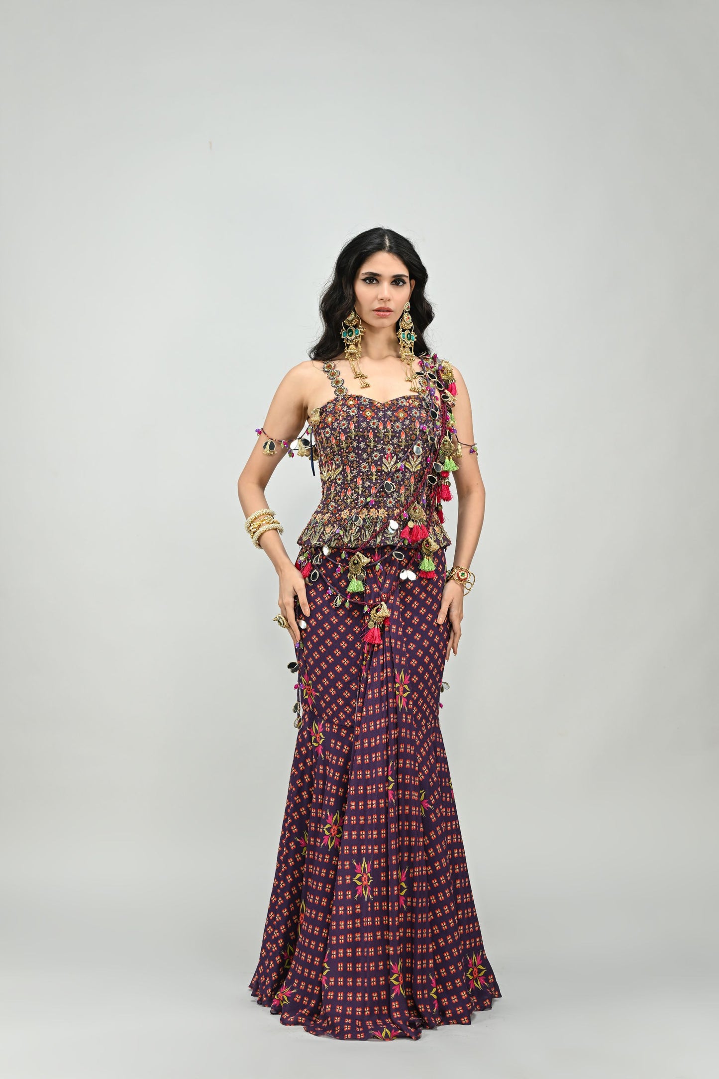 PLUM PRESTITCHED TASSEL SAREE PAIRED WITH BADLA EMBROIDERED PLUM CORSET