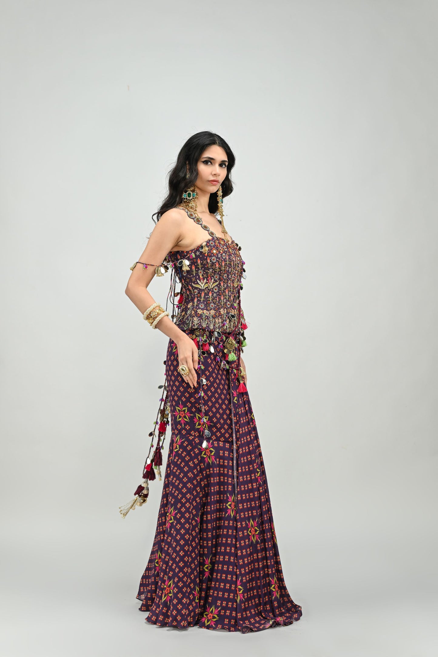 PLUM PRESTITCHED TASSEL SAREE PAIRED WITH BADLA EMBROIDERED PLUM CORSET