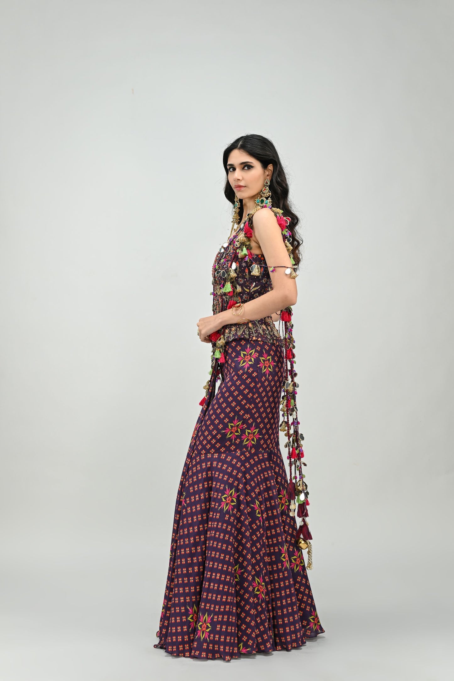 PLUM PRESTITCHED TASSEL SAREE PAIRED WITH BADLA EMBROIDERED PLUM CORSET