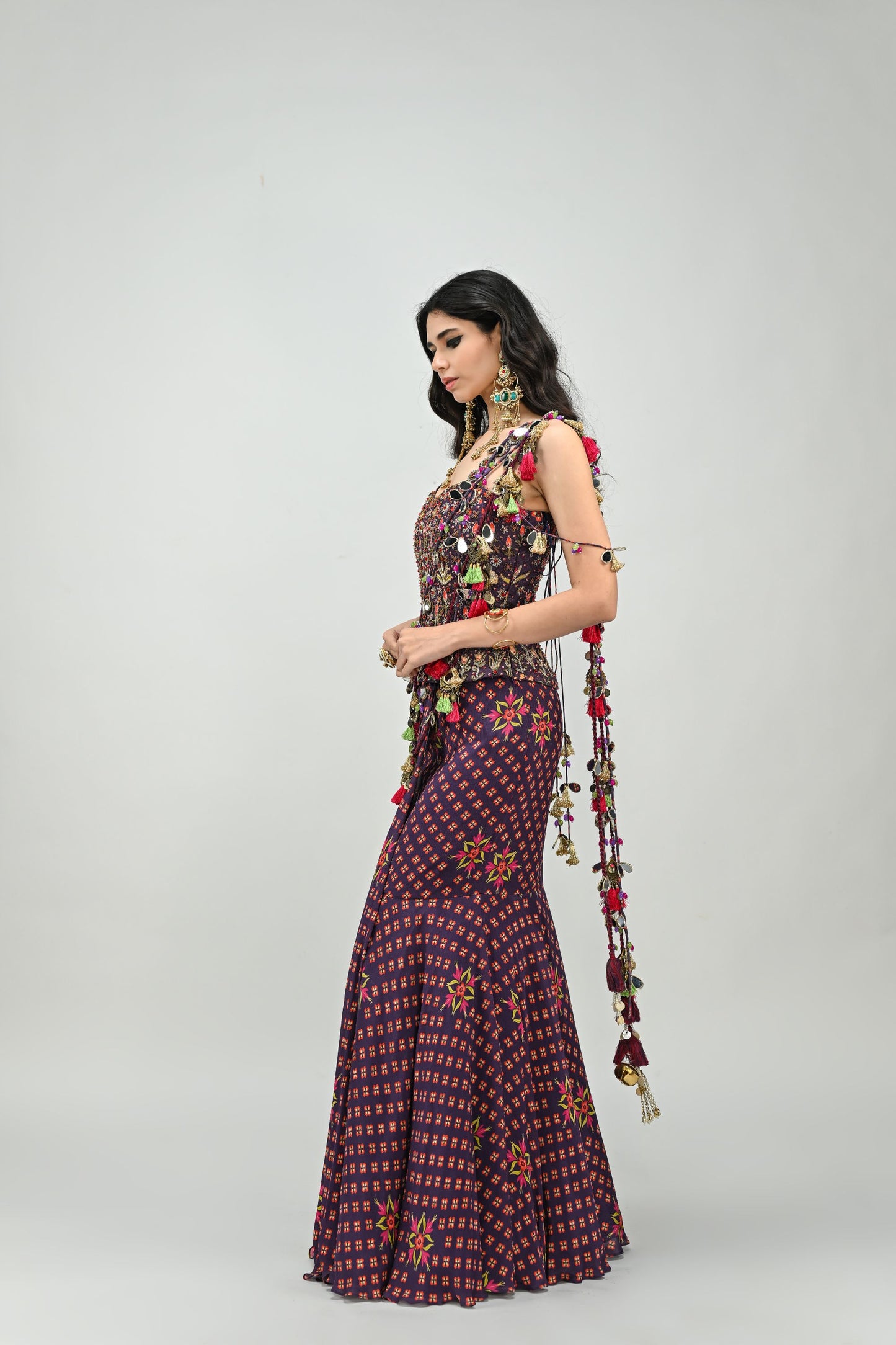 PLUM PRESTITCHED TASSEL SAREE PAIRED WITH BADLA EMBROIDERED PLUM CORSET