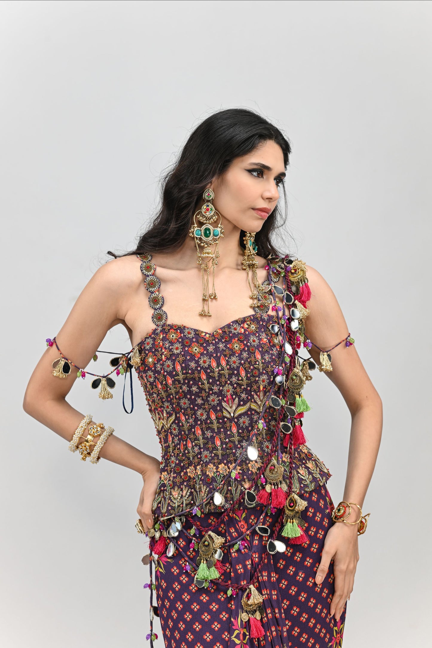 PLUM PRESTITCHED TASSEL SAREE PAIRED WITH BADLA EMBROIDERED PLUM CORSET