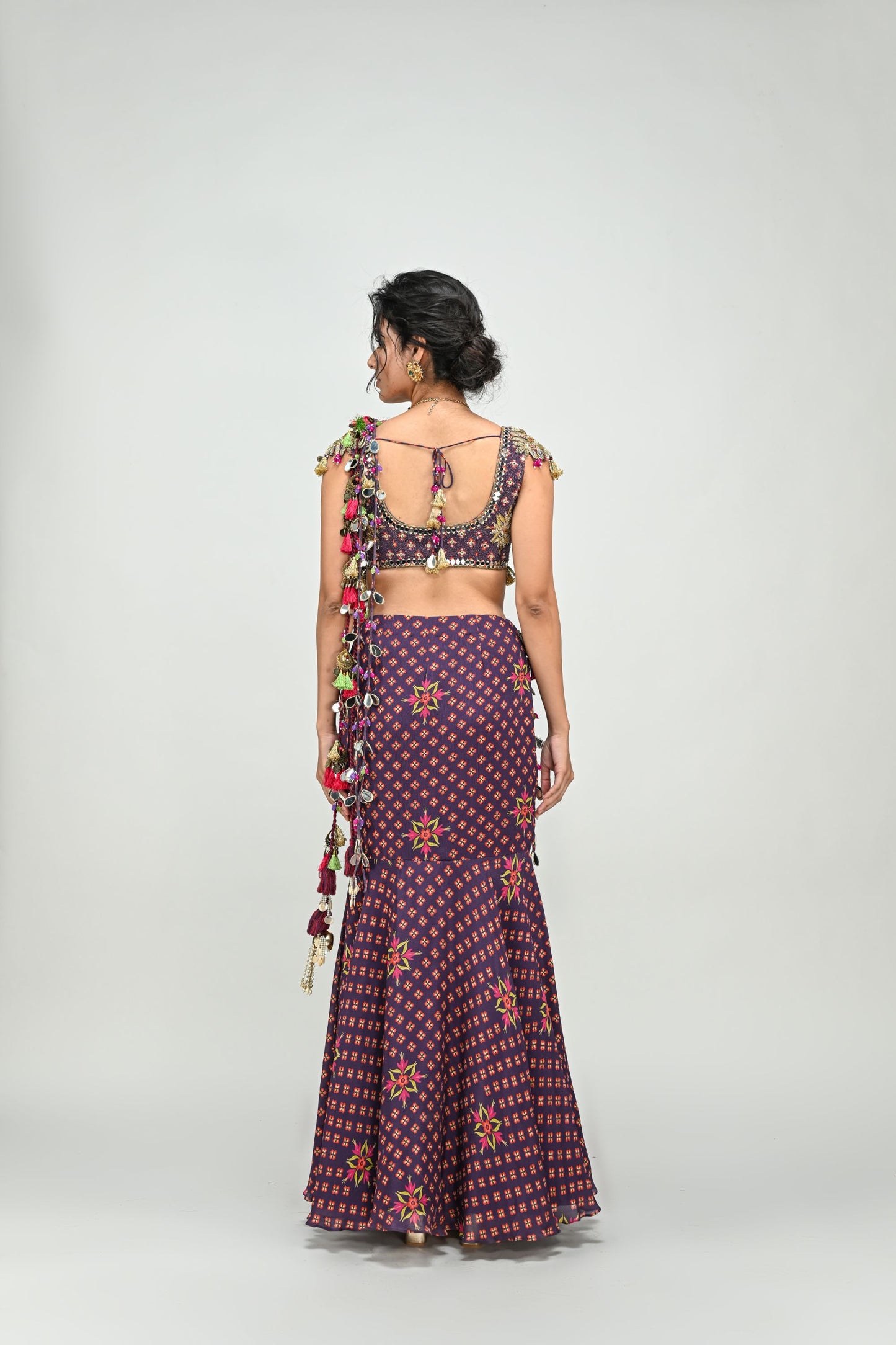 PLUM PRESTITCHED TASSEL SAREE PAIRED WITH BADLA EMBROIDERED PLUM BADLA HIGHLIGHTED BLOUSE