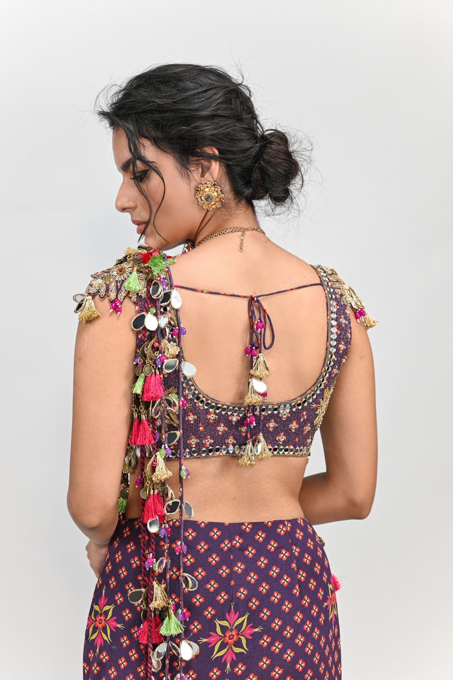 PLUM PRESTITCHED TASSEL SAREE PAIRED WITH BADLA EMBROIDERED PLUM BADLA HIGHLIGHTED BLOUSE