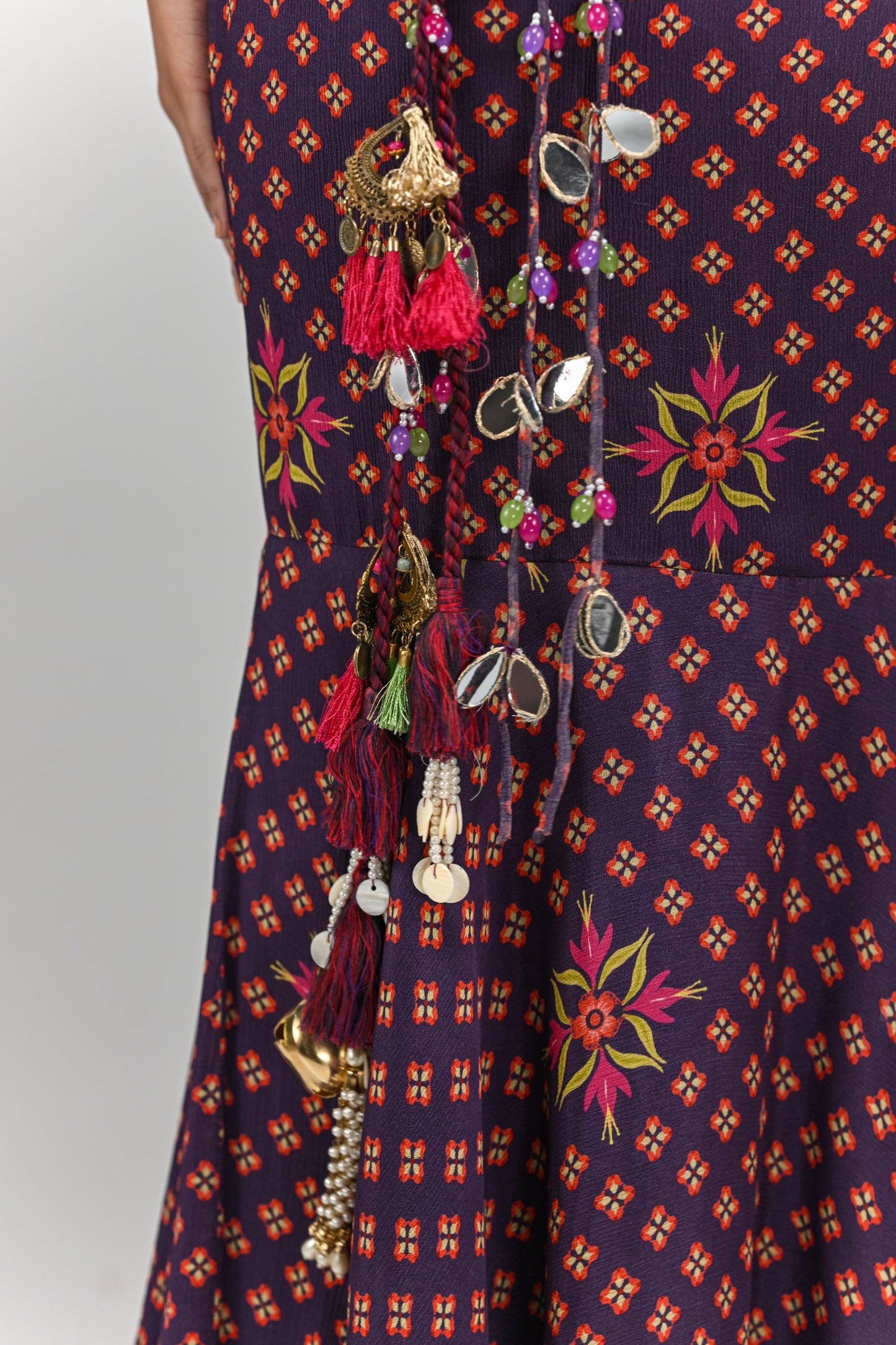PLUM PRESTITCHED TASSEL SAREE PAIRED WITH BADLA EMBROIDERED PLUM BADLA HIGHLIGHTED BLOUSE