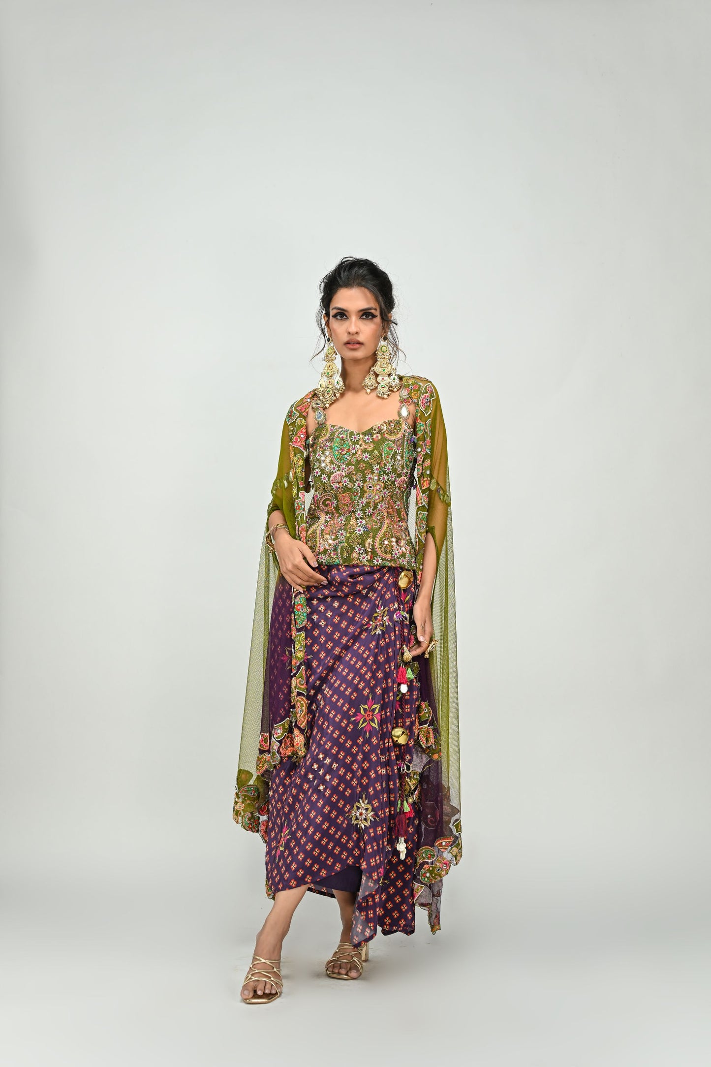 OLIVE BADLA EMBROIDERED CORSET PAIRED WITH EMBROIDERED PLUM DHOTI SET AND OMBRE APPLIQUE CAPE