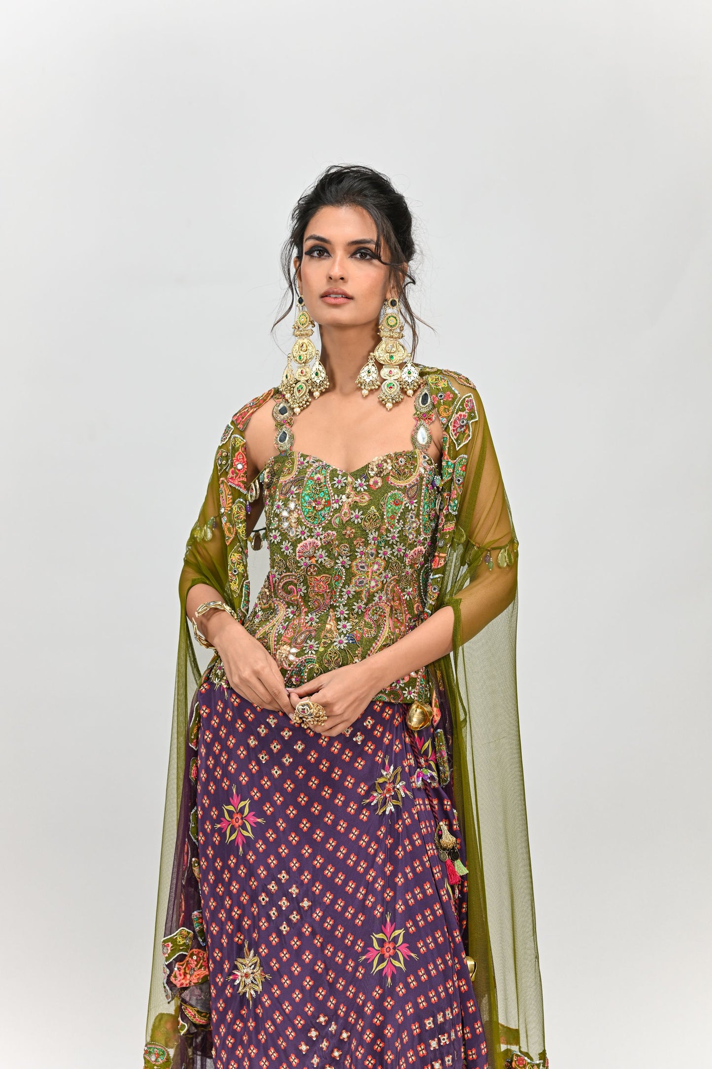 OLIVE BADLA EMBROIDERED CORSET PAIRED WITH EMBROIDERED PLUM DHOTI SET AND OMBRE APPLIQUE CAPE