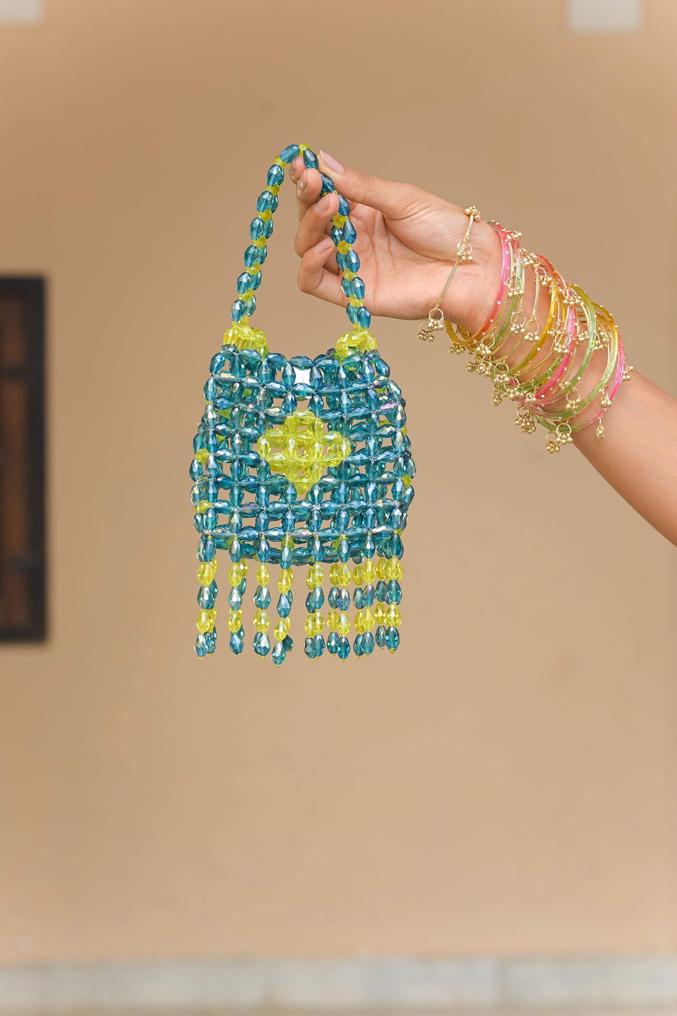 CRYTSAL IRIS MIST TASSEL POTLI