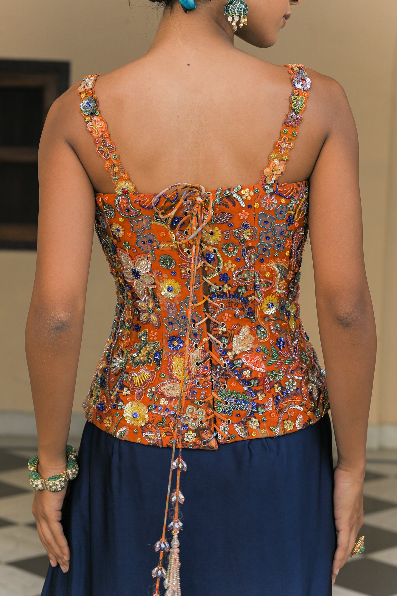 AMBER BLOOM HIGHLIGHT CORSET PAIRED WITH. NAVY BLUE COWL SKIRT SET