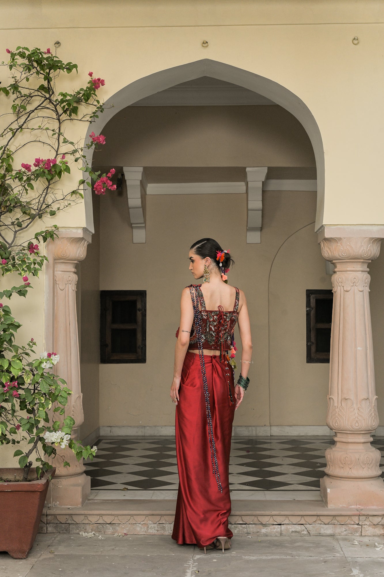 SCARLETTE DHOTI FLOWER PATCH TASSEL SAREE PAIRED. WITH THREAD WORK HIGHLIGHT CORSET BLOUSE