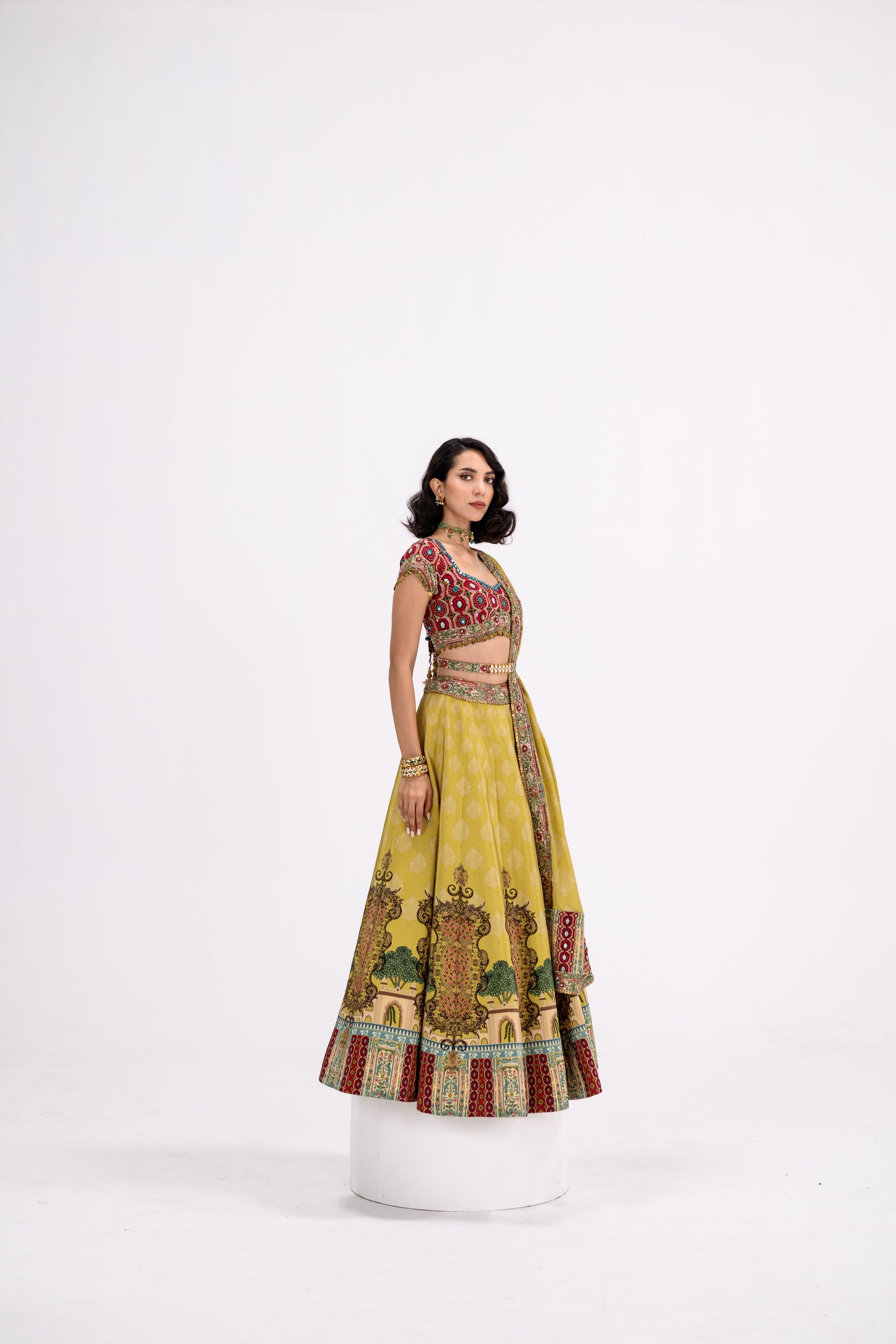 Mustard Print Lehenga Paired With Red Honey Comb Bralette And Dupatta