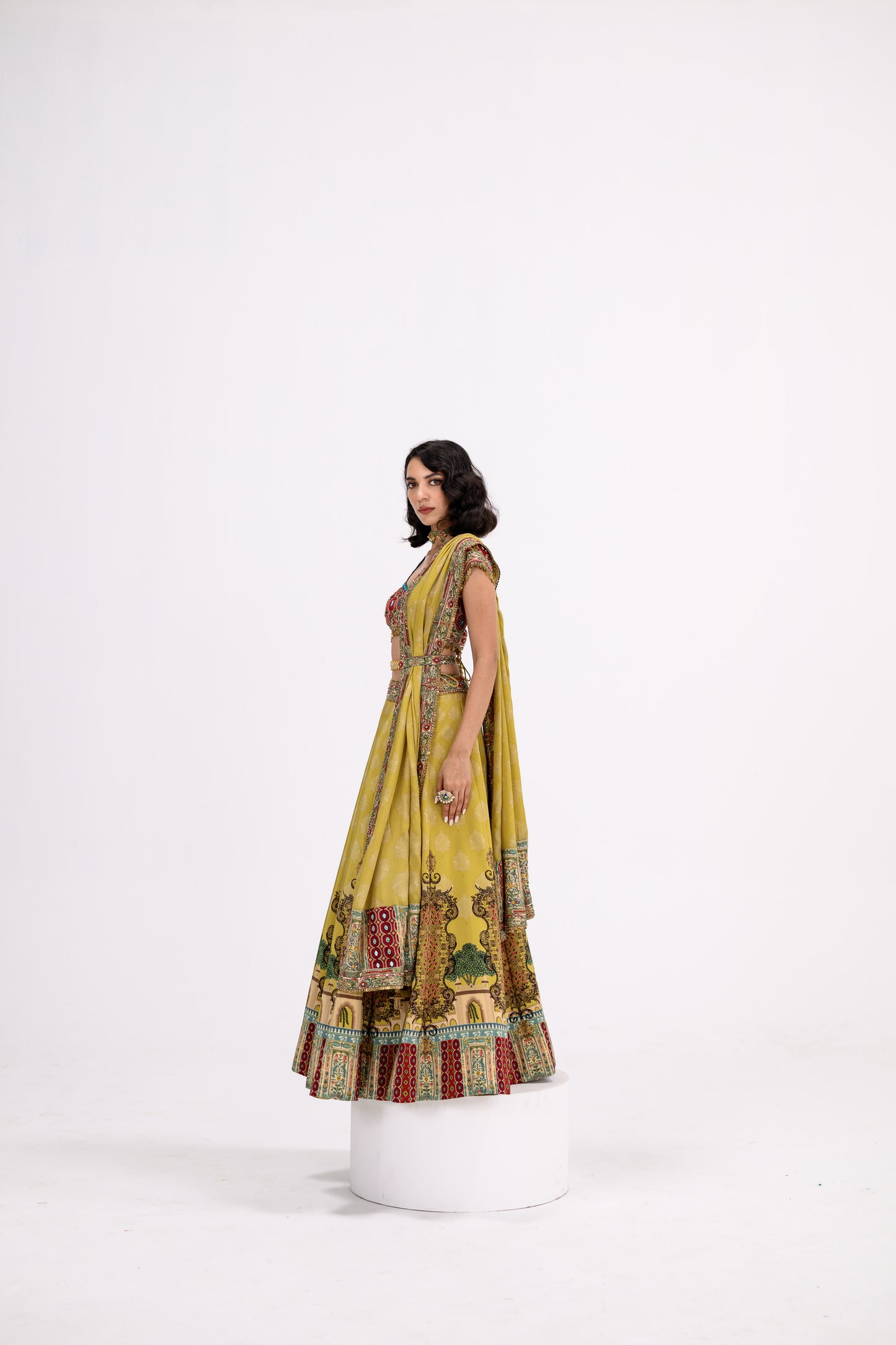 Mustard Print Lehenga Paired With Red Honey Comb Bralette And Dupatta