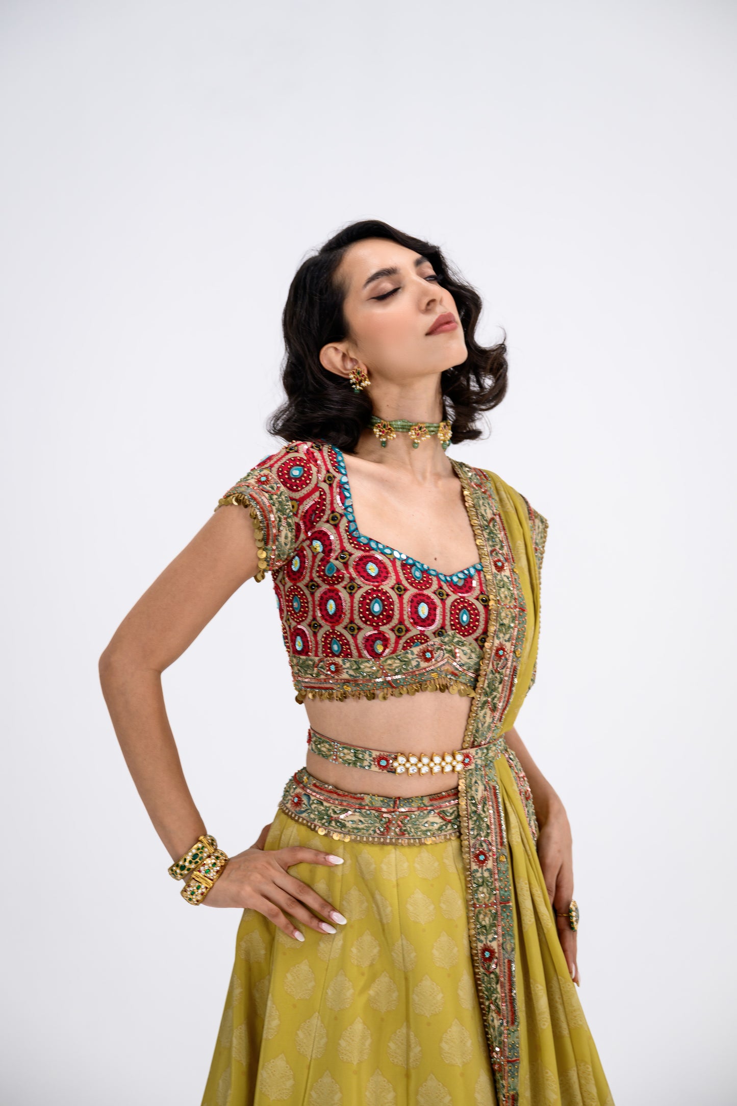 Mustard Print Lehenga Paired With Red Honey Comb Bralette And Dupatta