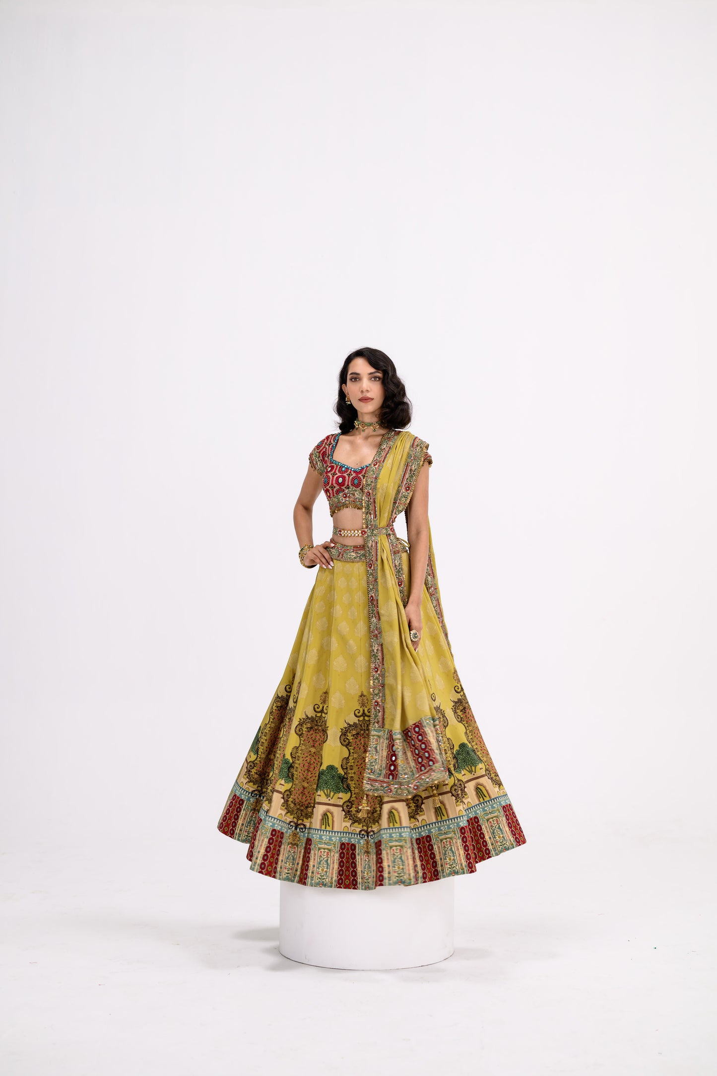 Mustard Print Lehenga Paired With Red Honey Comb Bralette And Dupatta
