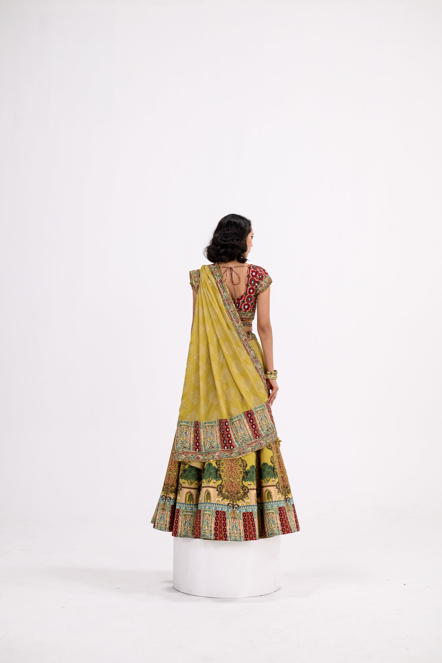 Mustard Print Lehenga Paired With Red Honey Comb Bralette And Dupatta