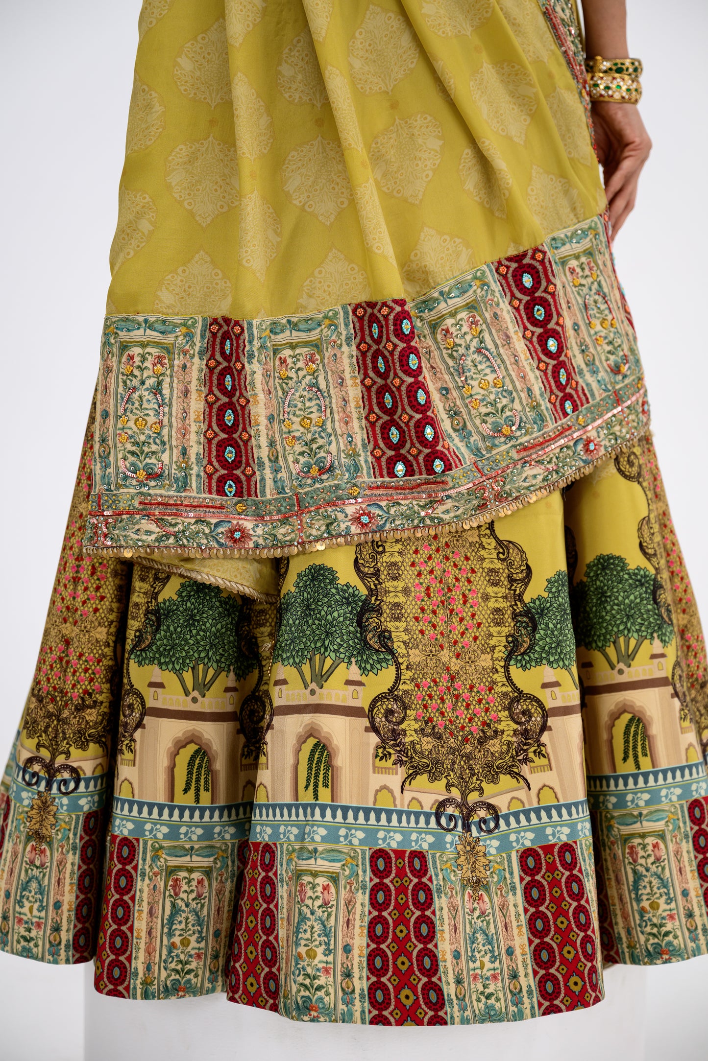 Mustard Print Lehenga Paired With Red Honey Comb Bralette And Dupatta