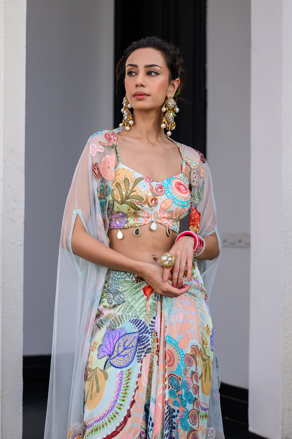 GARDENIA DHOTI SKIRT SET PAIRED WITH HIGHLITED BRALLETEE WITH HIGHLIGHTED APLLIQUE CAPE