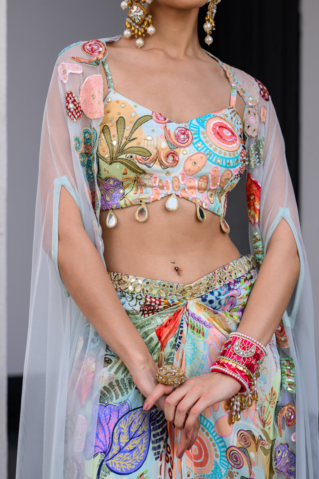 GARDENIA DHOTI SKIRT SET PAIRED WITH HIGHLITED BRALLETEE WITH HIGHLIGHTED APLLIQUE CAPE