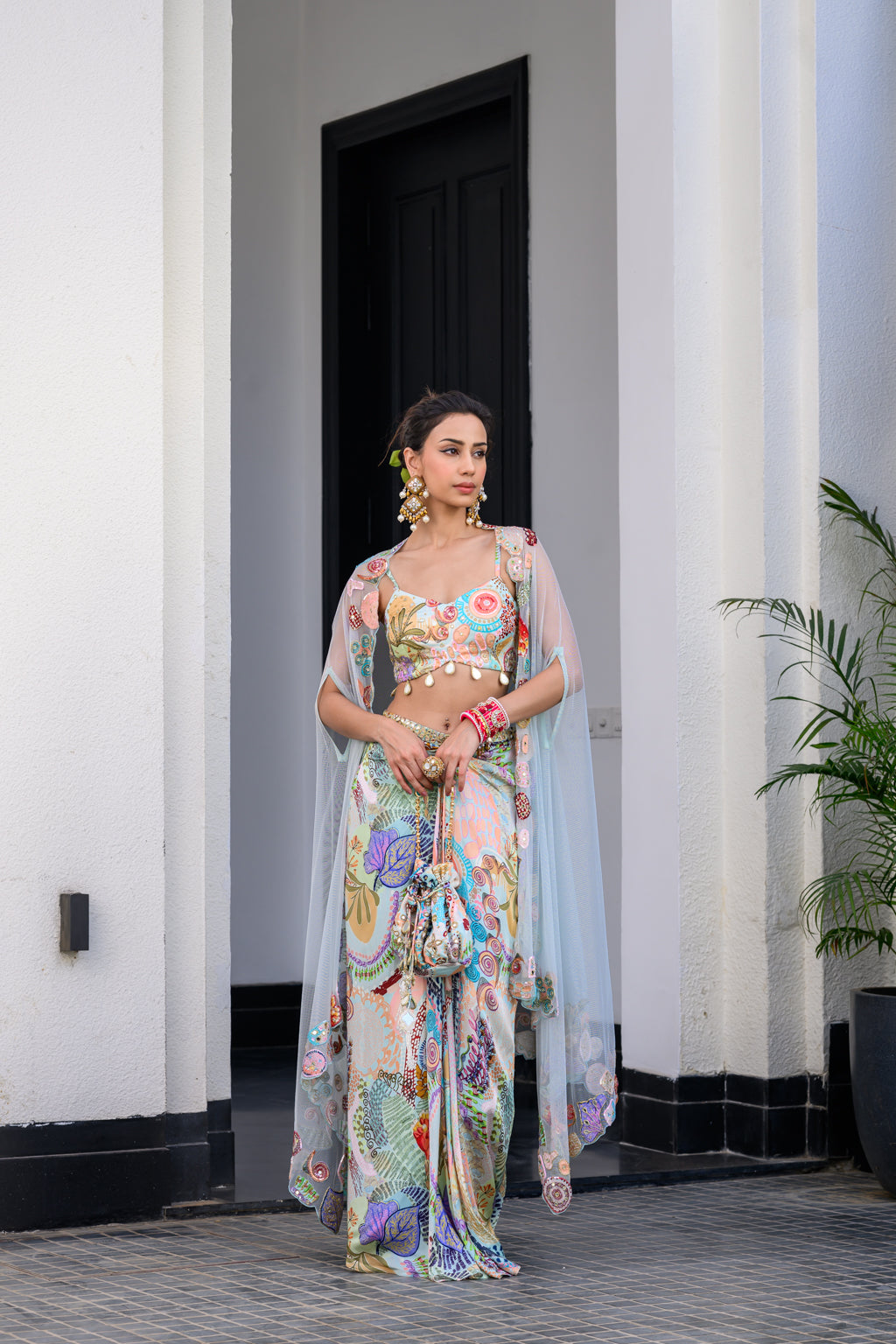 GARDENIA DHOTI SKIRT SET PAIRED WITH HIGHLITED BRALLETEE WITH HIGHLIGHTED APLLIQUE CAPE