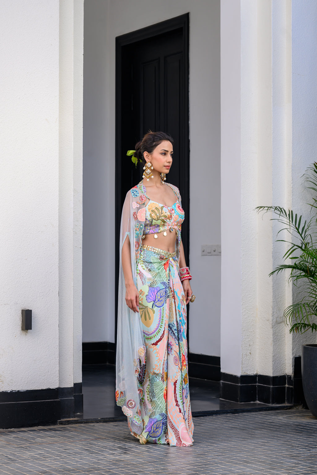 GARDENIA DHOTI SKIRT SET PAIRED WITH HIGHLITED BRALLETEE WITH HIGHLIGHTED APLLIQUE CAPE