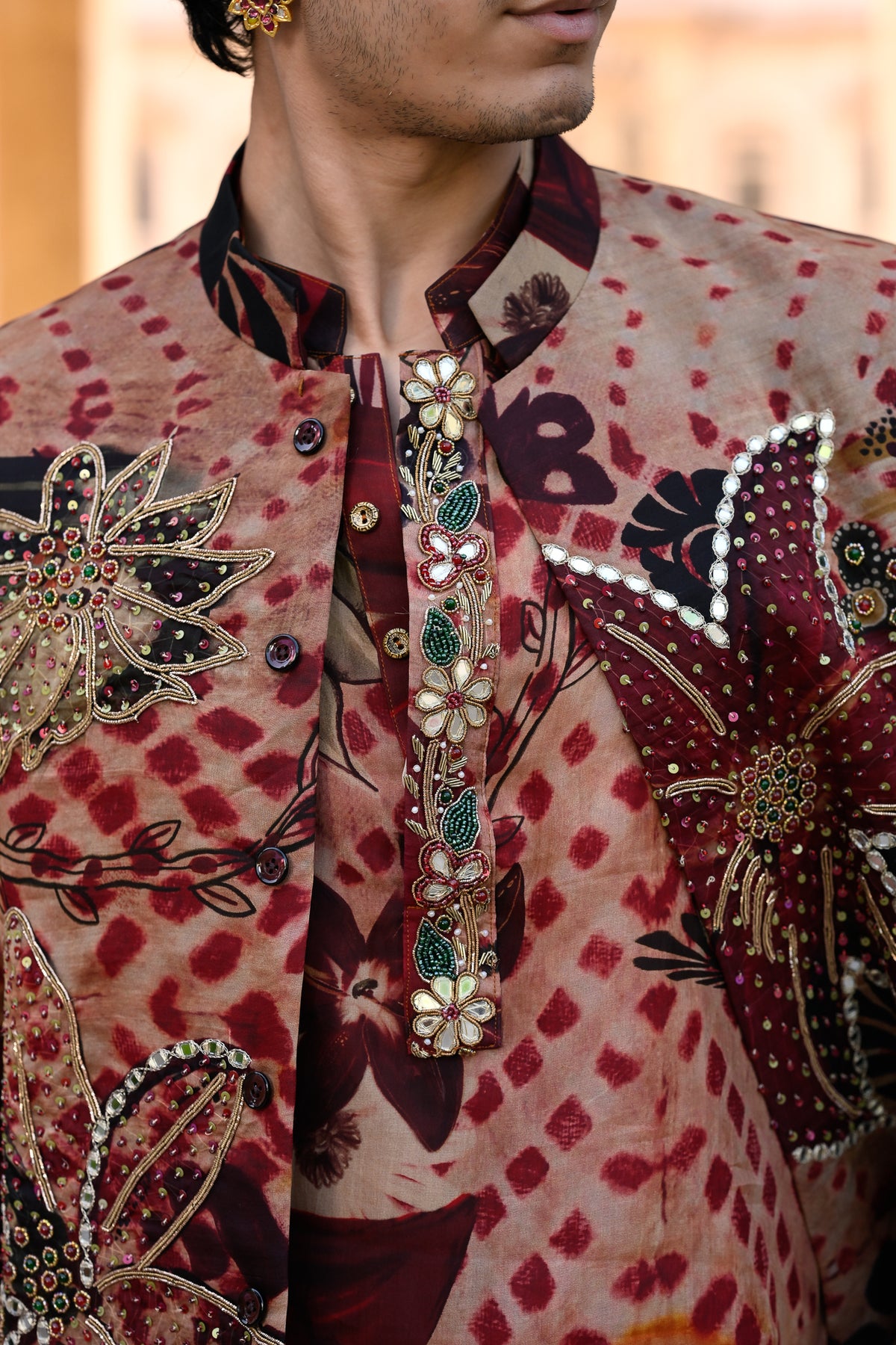 MARRON HIGHLIGHTED BUNDI WITH ORGANZA PRINTED KURTA PURTIN & CUFF EMB WITH MAROON FLAIR PANT