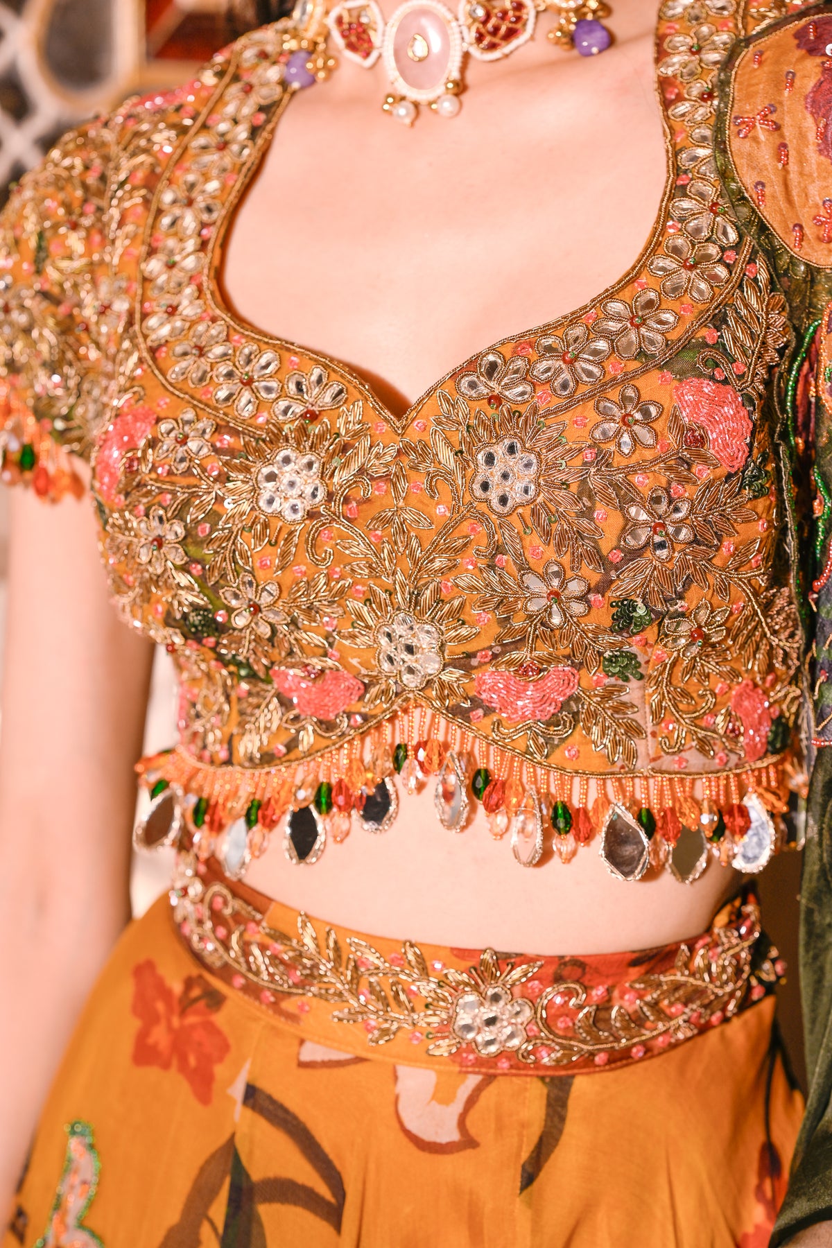 EMB BLOUSE PAIRED WITH HIGHLIGHTED LEHENGA WITH APPLIQUE DUEL CAPE