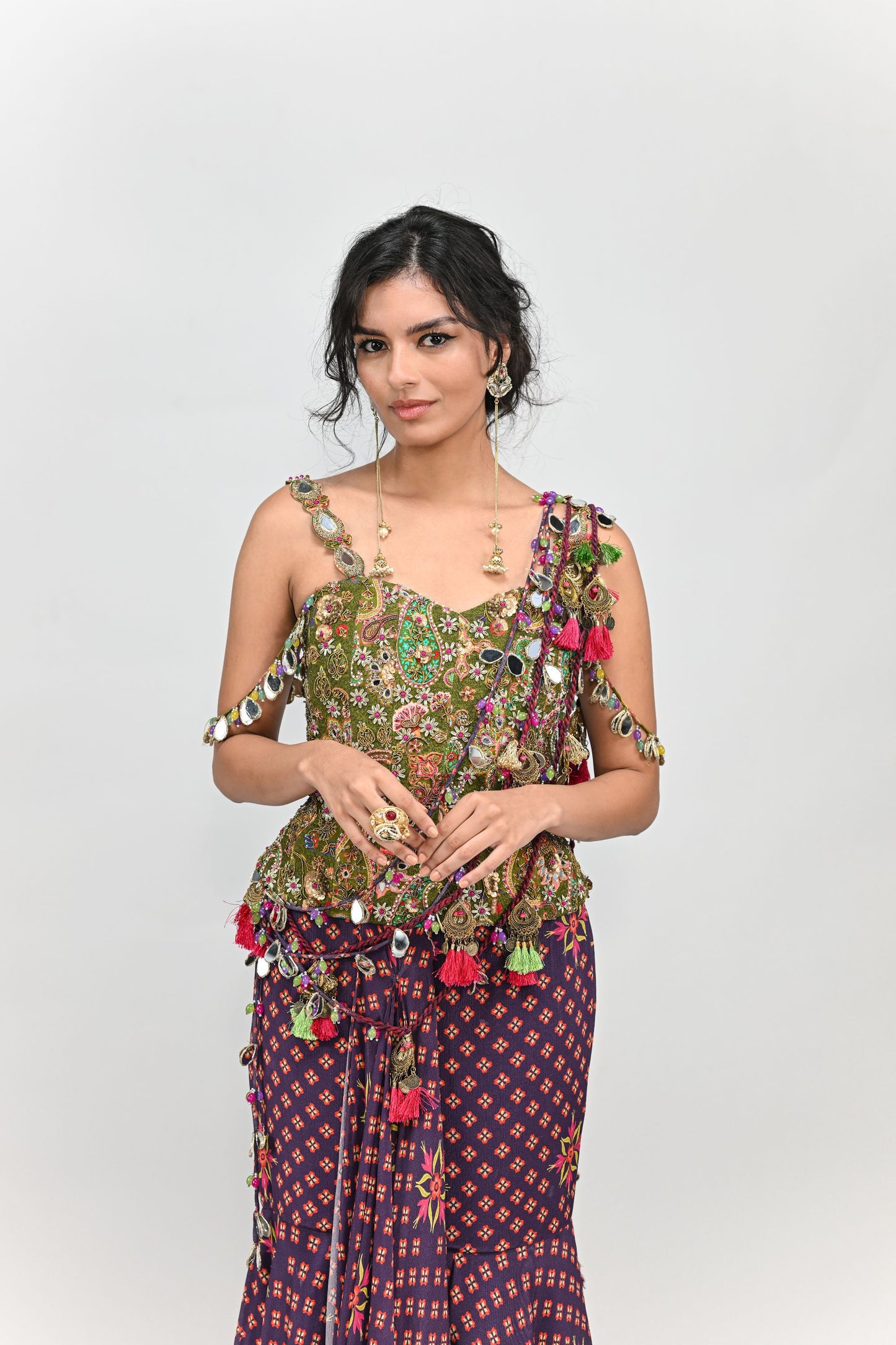 PLUM PRESTITCHED TASSEL SAREE PAIRED WITH BADLA EMBROIDERED GREEN CORSET