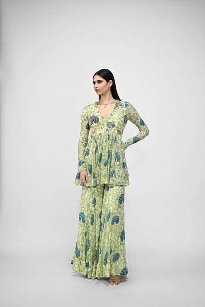 Peacock Highlited Peplum Kurta Paired With Peacock Sharara Pants