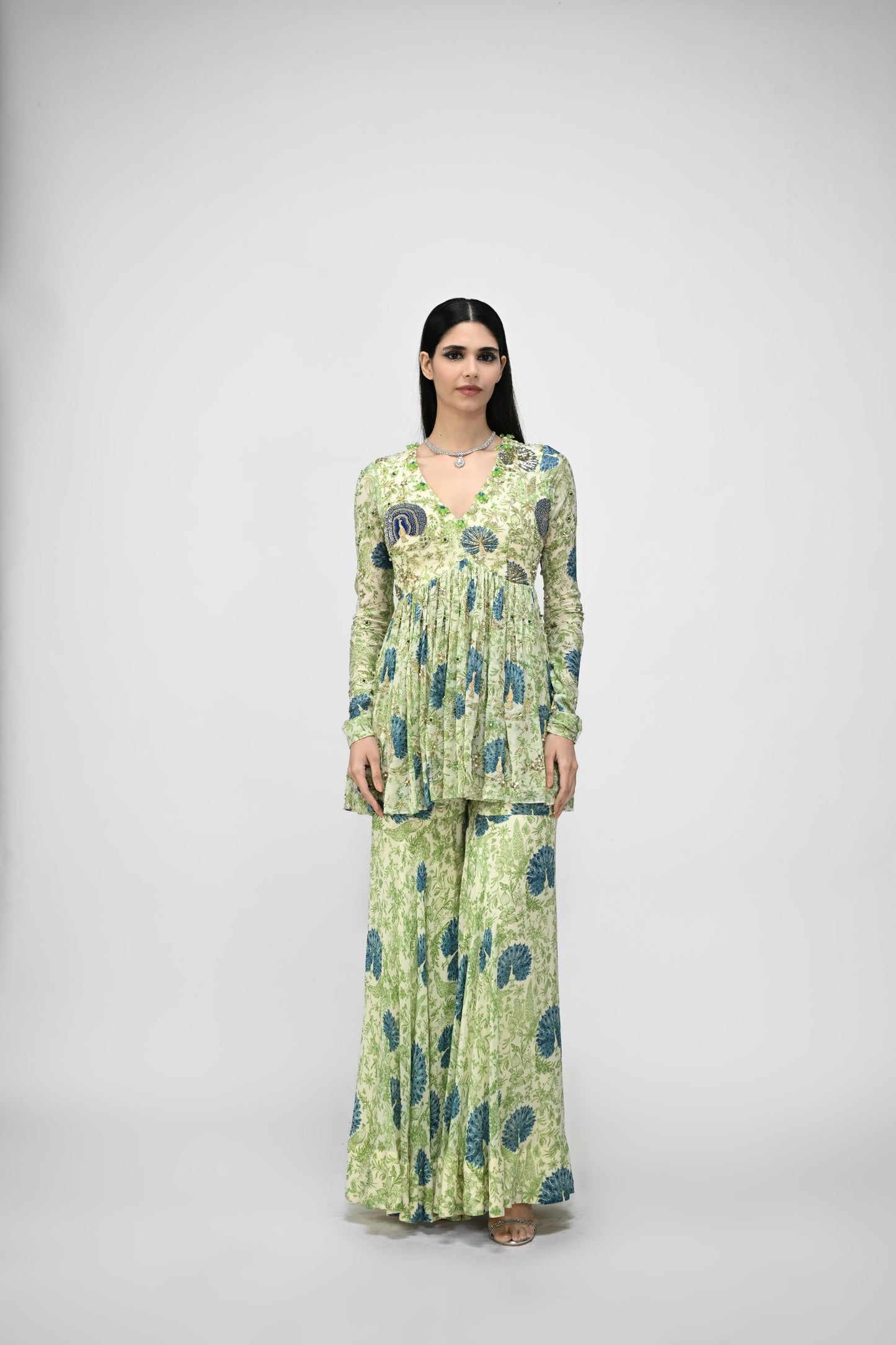 Peacock Highlited Peplum Kurta Paired With Peacock Sharara Pants