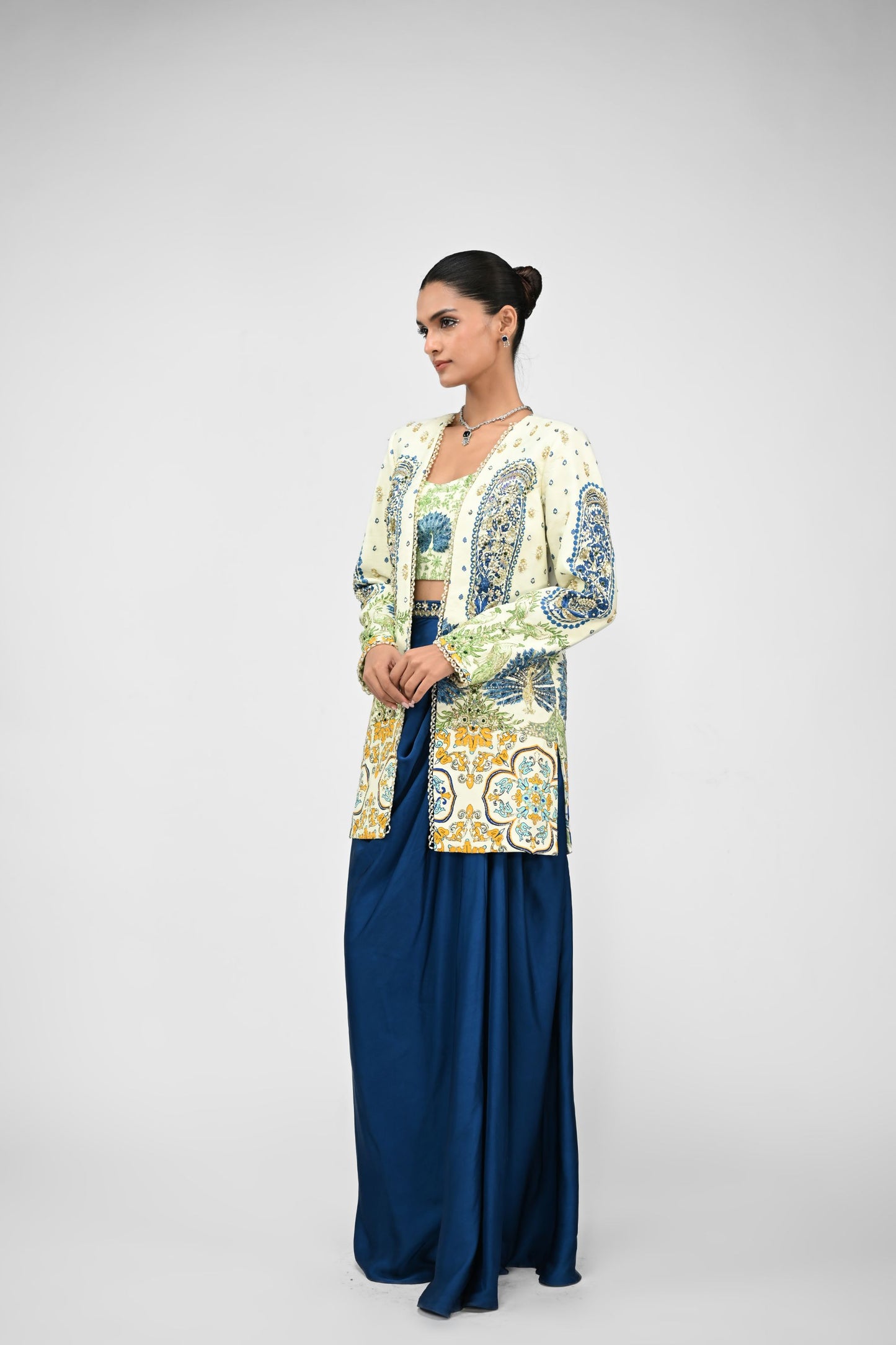 Royal Highlighted Blazer Paired With Peacock Bralette And Blue Cowl Skirt