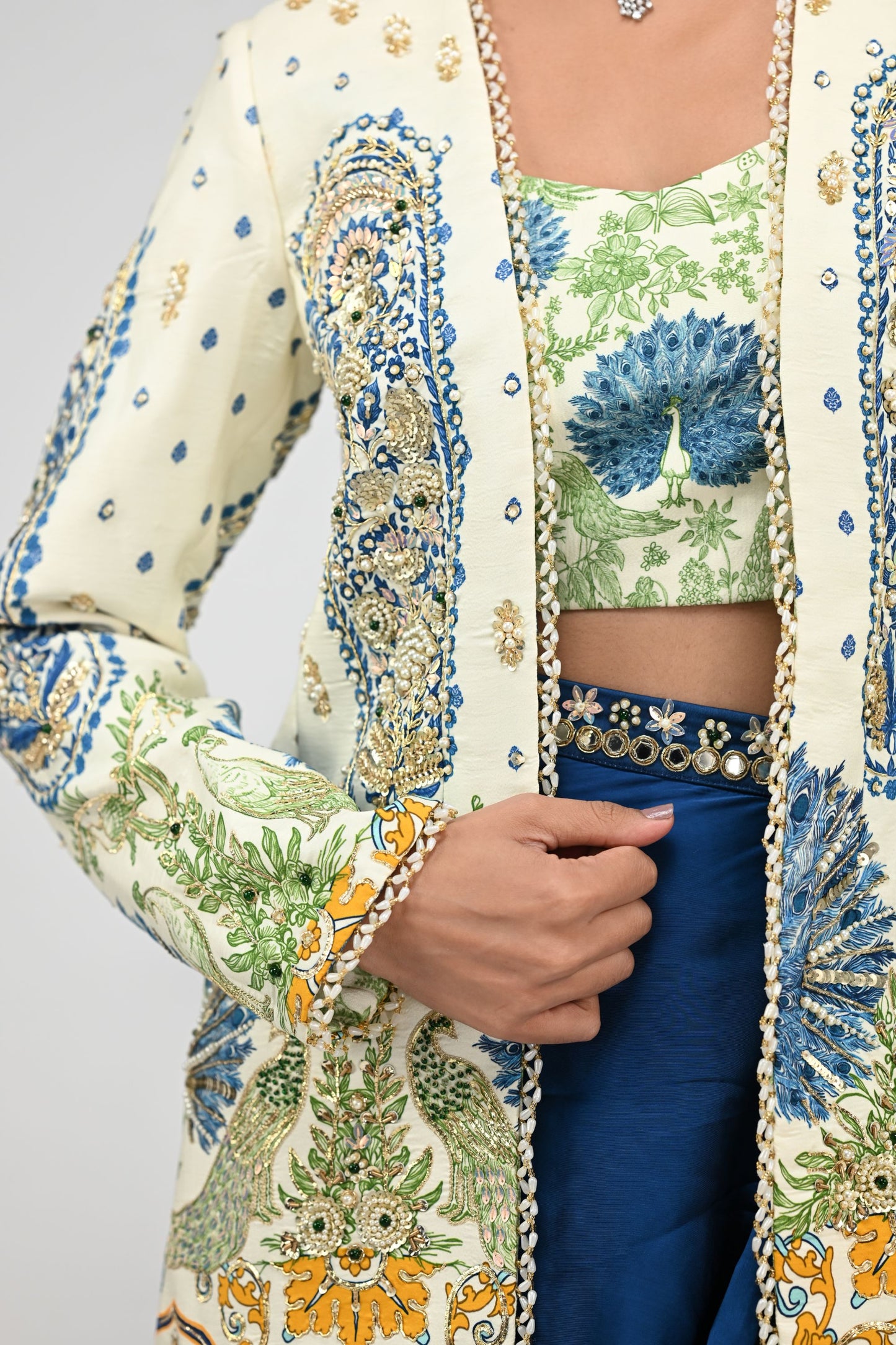 Royal Highlighted Blazer Paired With Peacock Bralette And Blue Cowl Skirt