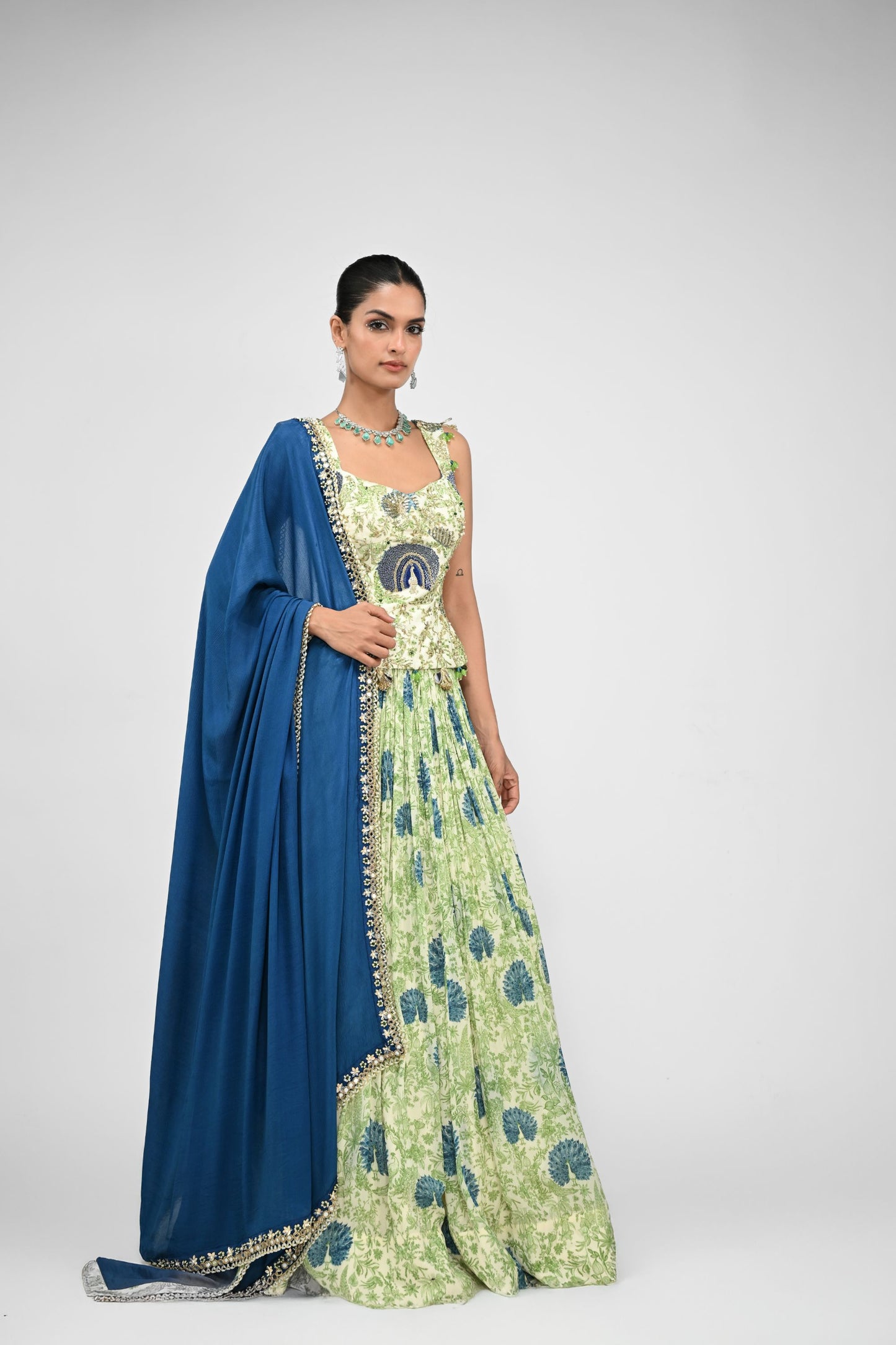 Peacock Highlighted Lehenga Paired With Highlighted Peacock Corset And Embroidered Dupa