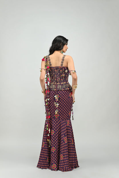 PLUM PRESTITCHED TASSEL SAREE PAIRED WITH BADLA EMBROIDERED PLUM CORSET