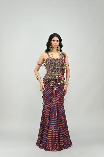 PLUM PRESTITCHED TASSEL SAREE PAIRED WITH BADLA EMBROIDERED PLUM CORSET