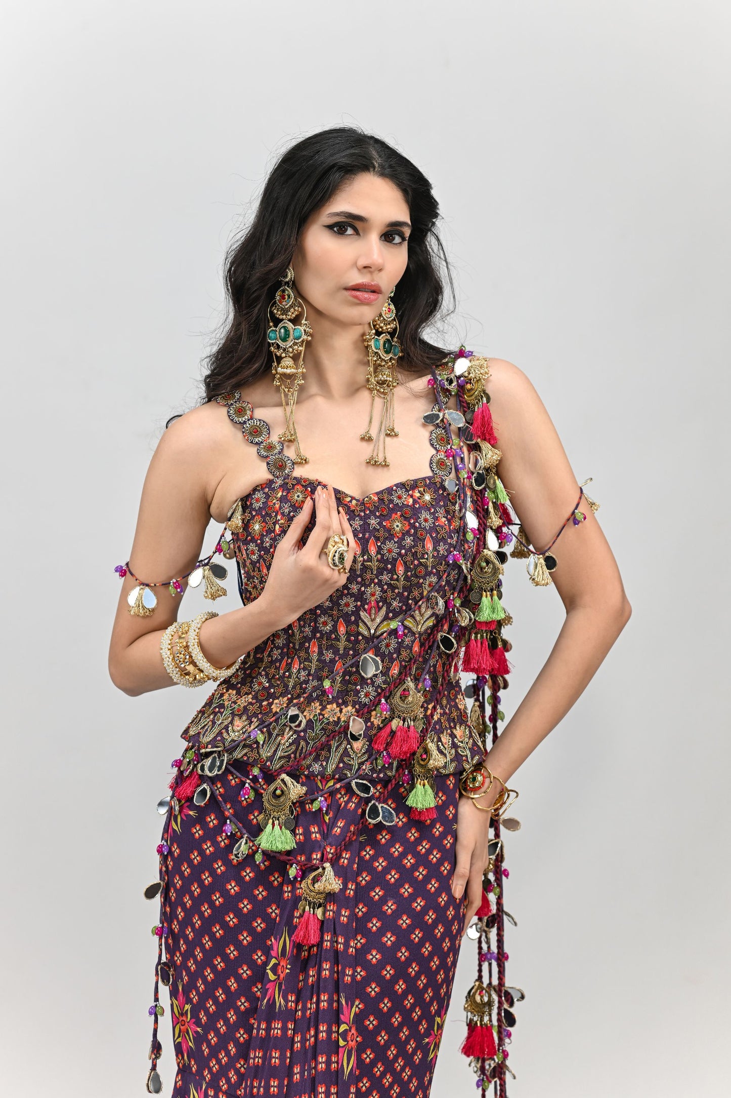 PLUM PRESTITCHED TASSEL SAREE PAIRED WITH BADLA EMBROIDERED PLUM CORSET