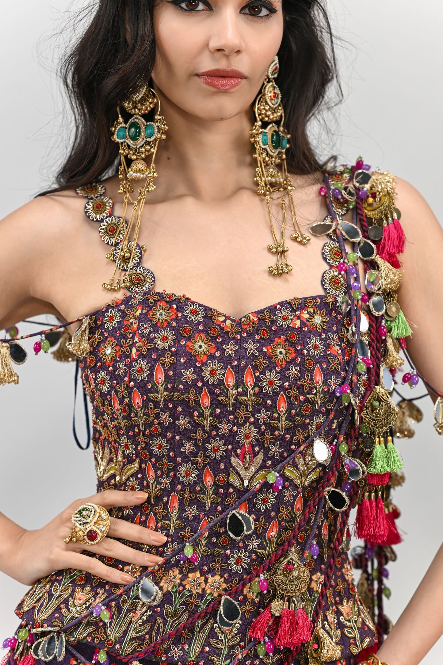 PLUM PRESTITCHED TASSEL SAREE PAIRED WITH BADLA EMBROIDERED PLUM CORSET