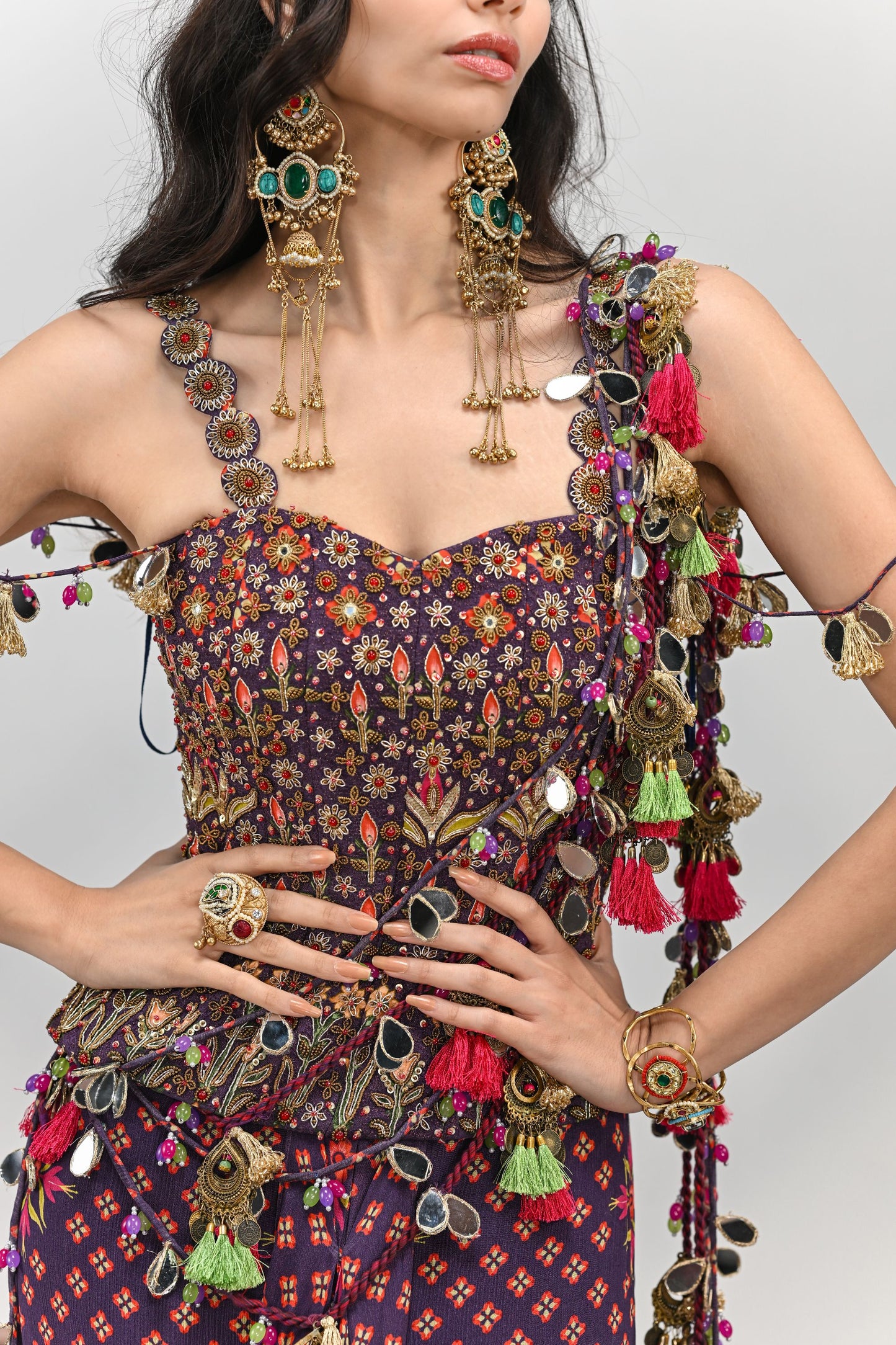 PLUM PRESTITCHED TASSEL SAREE PAIRED WITH BADLA EMBROIDERED PLUM CORSET