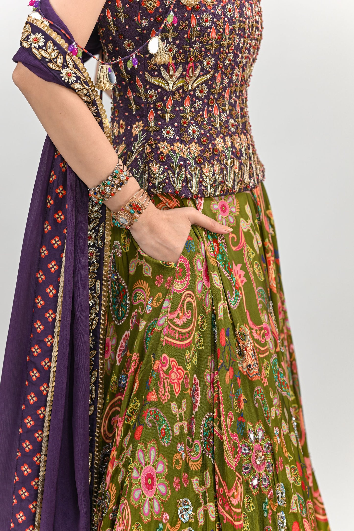 OLIVE HIGHLIGHTED LEHENGA PAIRED WITH PLUM EMBROIDERED BADLA CORSET AND DUPATTA