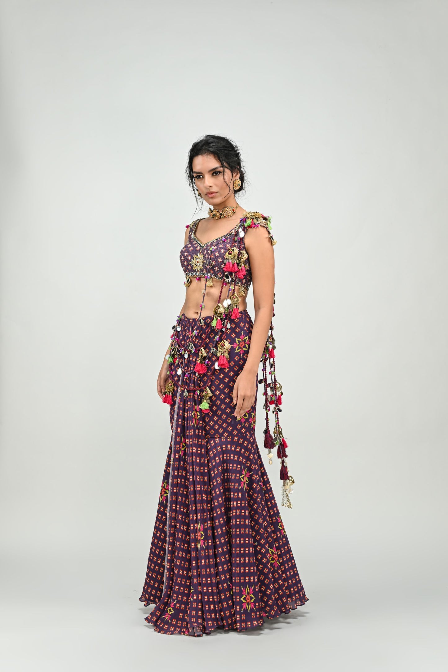 PLUM PRESTITCHED TASSEL SAREE PAIRED WITH BADLA EMBROIDERED PLUM BADLA HIGHLIGHTED BLOUSE