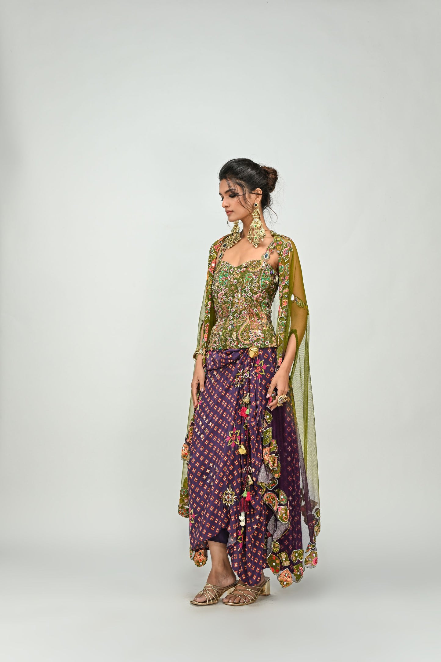 OLIVE BADLA EMBROIDERED CORSET PAIRED WITH EMBROIDERED PLUM DHOTI SET AND OMBRE APPLIQUE CAPE