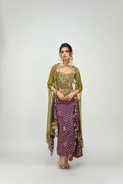 OLIVE BADLA EMBROIDERED CORSET PAIRED WITH EMBROIDERED PLUM DHOTI SET AND OMBRE APPLIQUE CAPE