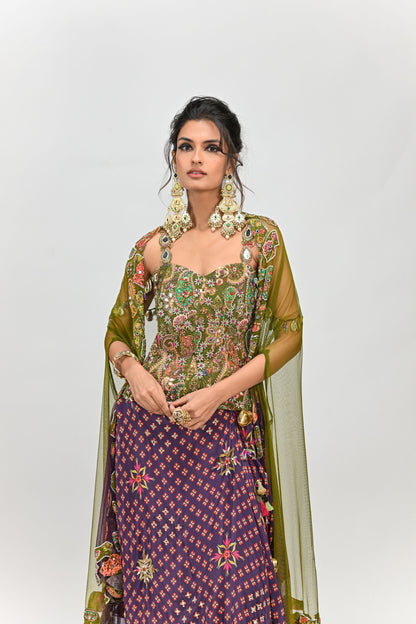OLIVE BADLA EMBROIDERED CORSET PAIRED WITH EMBROIDERED PLUM DHOTI SET AND OMBRE APPLIQUE CAPE