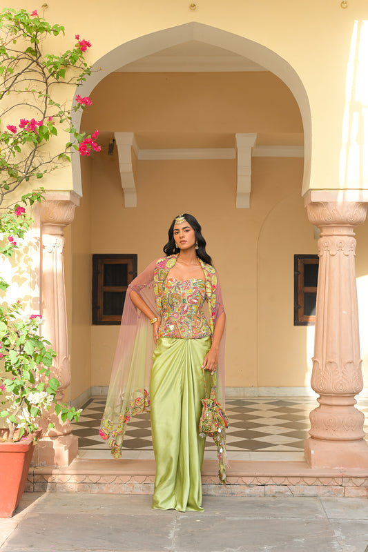 OLIVE BLOOM SEQUENCE HIGHLIGHT. CORSET PAIRED WITH THROW. MILANO SKIRT AND DUAL APPLIQUE HIGHLIGHT CAPE SET