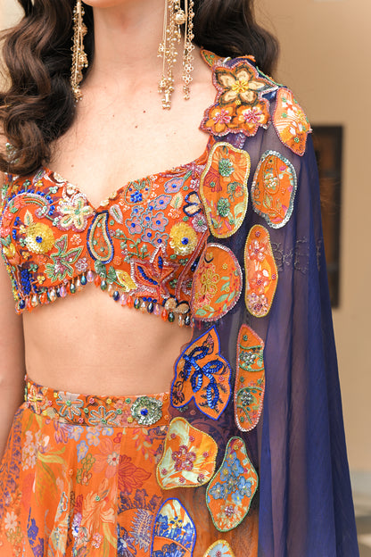 AMBER BLOOM HIGHLIGHTED LEHENGA PAIRED WITH EMBROIDERED BLOUSE AND SHADED APPLIQUE ORGANZA DUPATTA