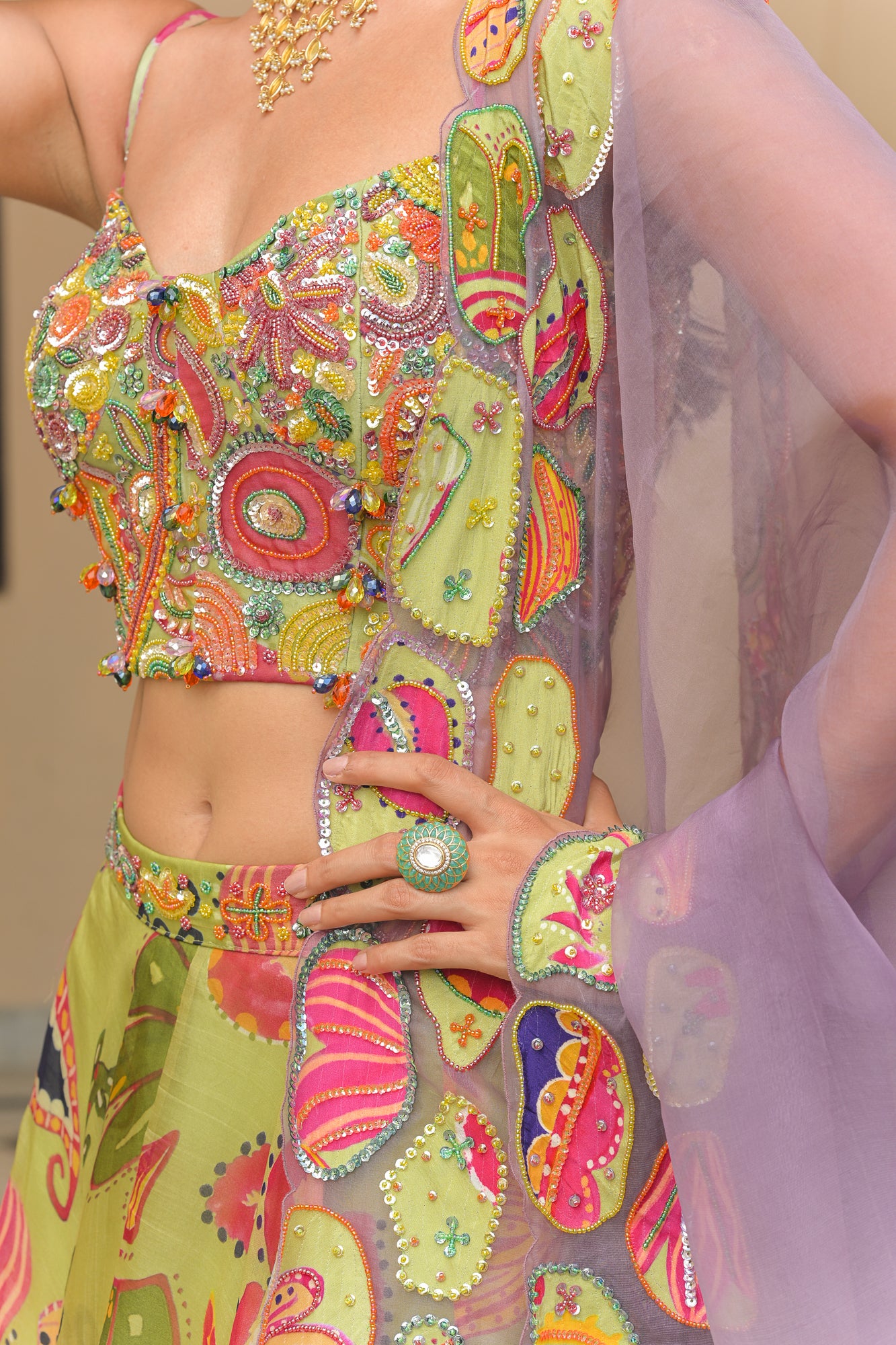 OLIVE BLOOM HIGHLIGHT LEHENGAS PAIRED WITH HIGHLIGHT CORSET AND SHADED APPLIQUÉ. HIGHLIGHT DUPATTA