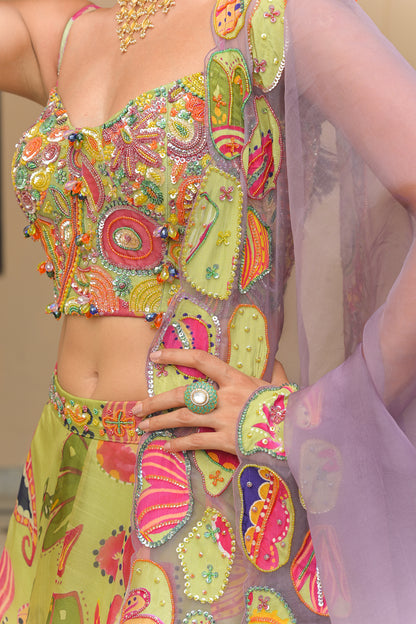 OLIVE BLOOM HIGHLIGHT LEHENGAS PAIRED WITH HIGHLIGHT CORSET AND SHADED APPLIQUÉ. HIGHLIGHT DUPATTA